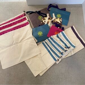 Assorted Tory Burch shopping bags and dust bags! 5 shoppers and 10 dust bags!
